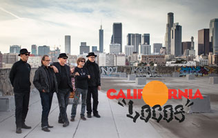 SOMOS LOCOS group picture on rooftop with downtown Los Angeles in the background