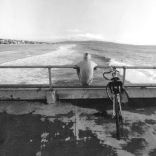 1970 Surf Watching from the Pier by Post, Johnh